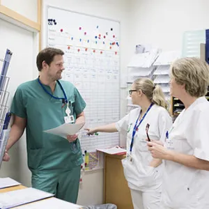 A group of health care workers in a room