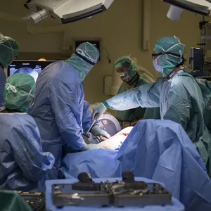 A group of surgeons performing surgery